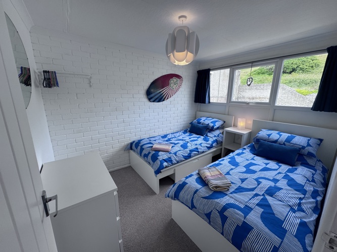 Twin bedroom with clothes storage