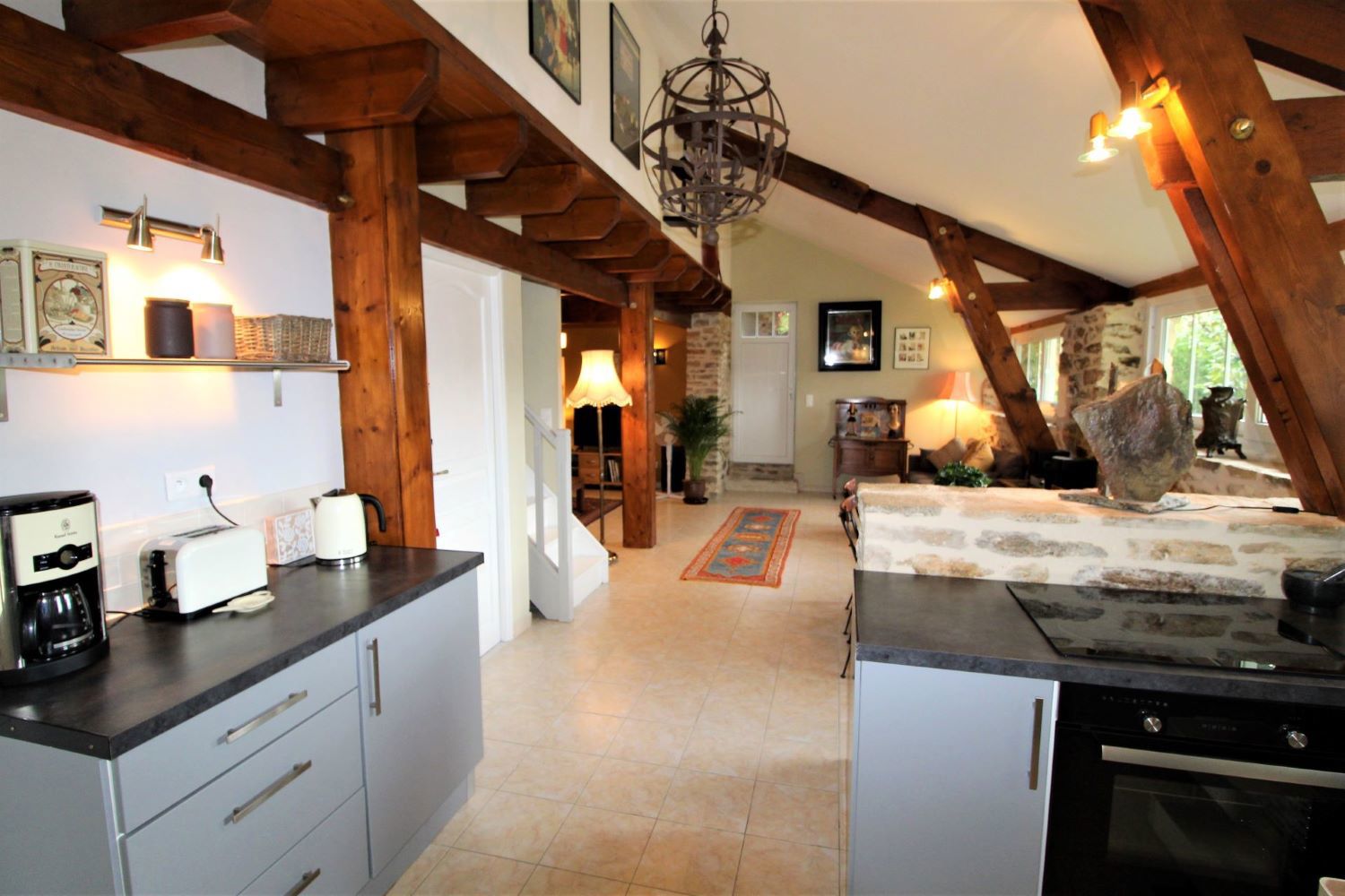 A kitchen with a stove and oven, providing essential cooking appliances for meal preparation.