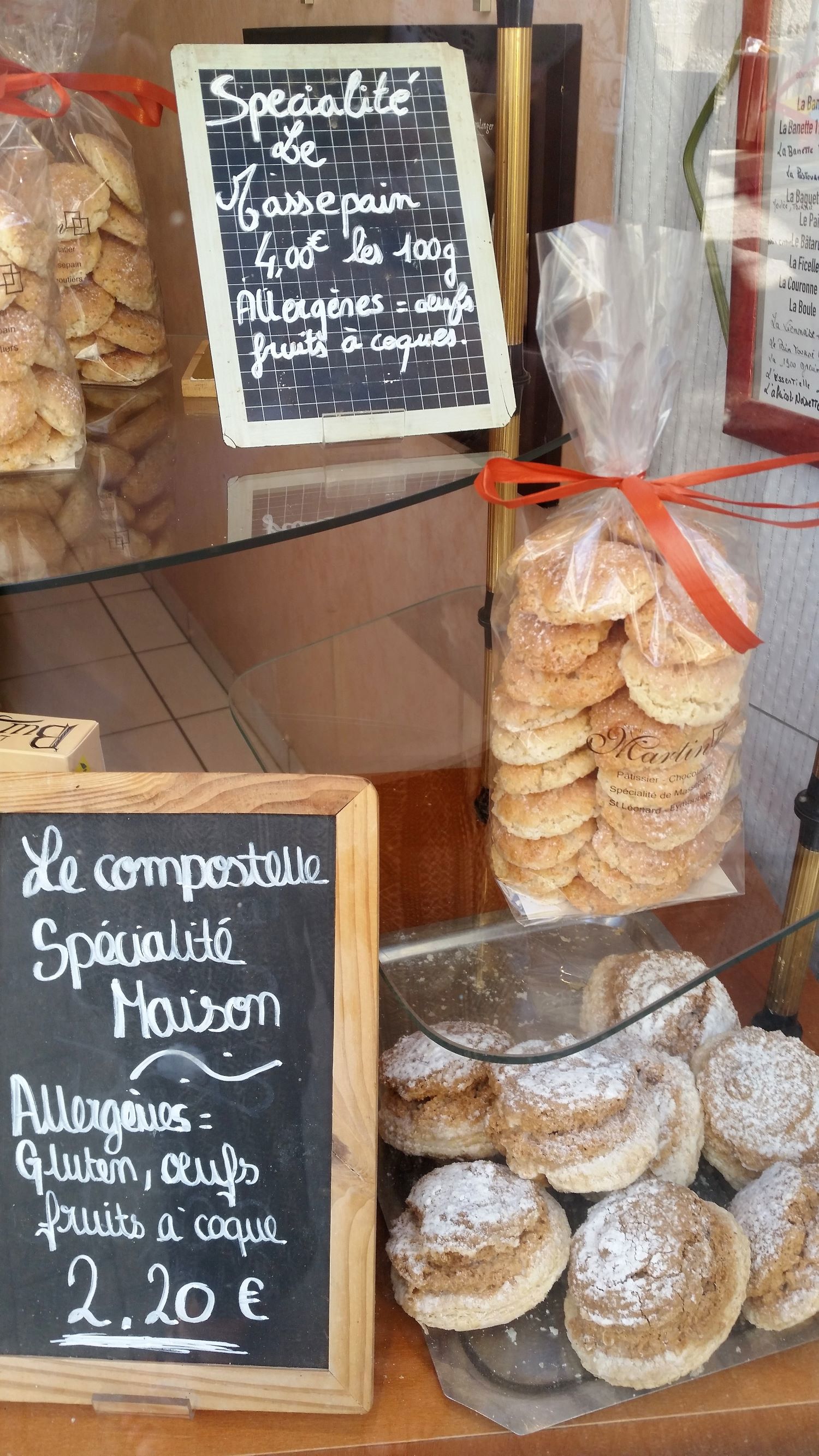 Marzipan biscuits House made marzipan biscuits in cellophane bags in shop window in France