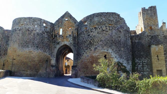 Domme, Dordogne Medieval twin tower entrance to beautiful village Domme
