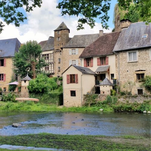 Segur-le-chateau Segur-le-chateau with the river in front of old houses