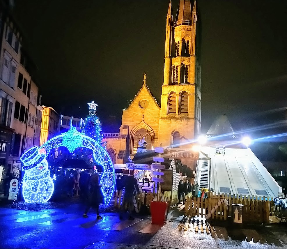 Christmas market illuminations by the church in Limoges at night