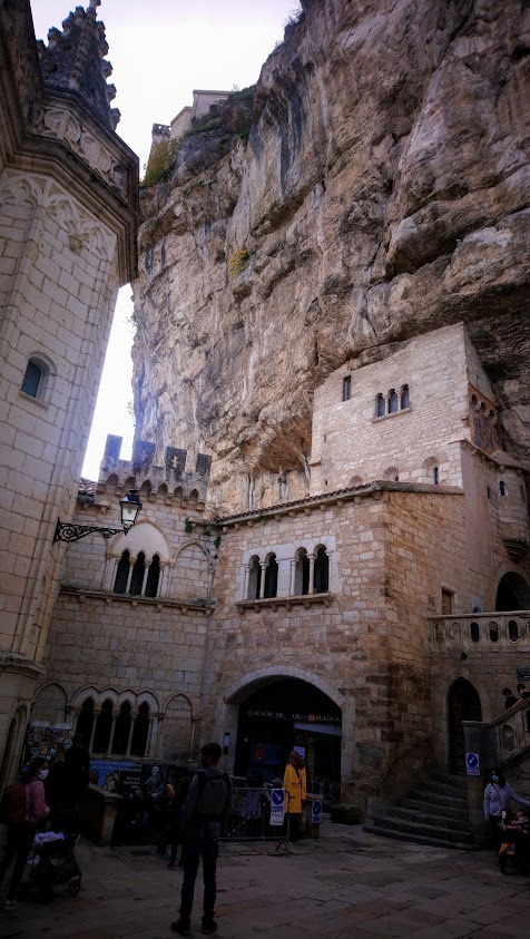 Rocamadour Rocamadour a church perched on a hill as seen through a arched bridge with ancient streets