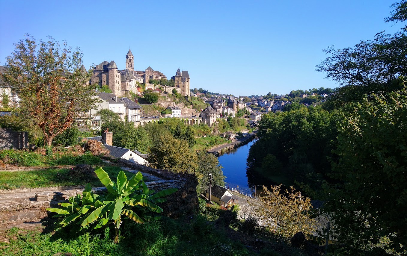 Uzerche Uzerche town walls and grassy banks with old turreted houses