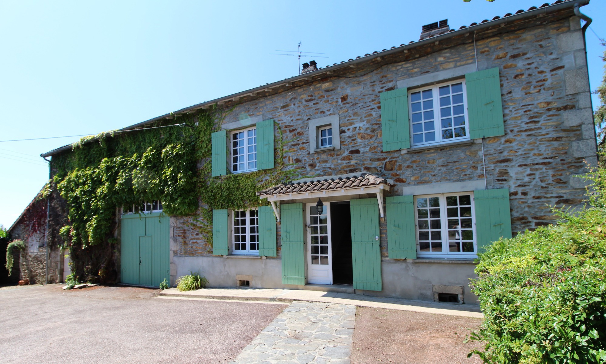 Stone house with green shutters in Mialet Your French Stay - and gite Beaux Souvenirs