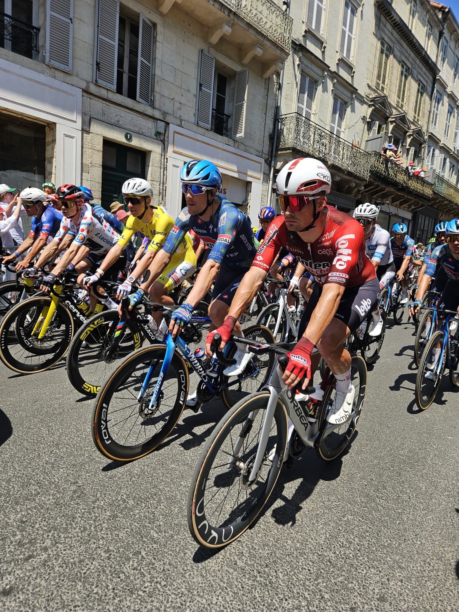 Tour de France riders in the peloton, including the yellow jersey