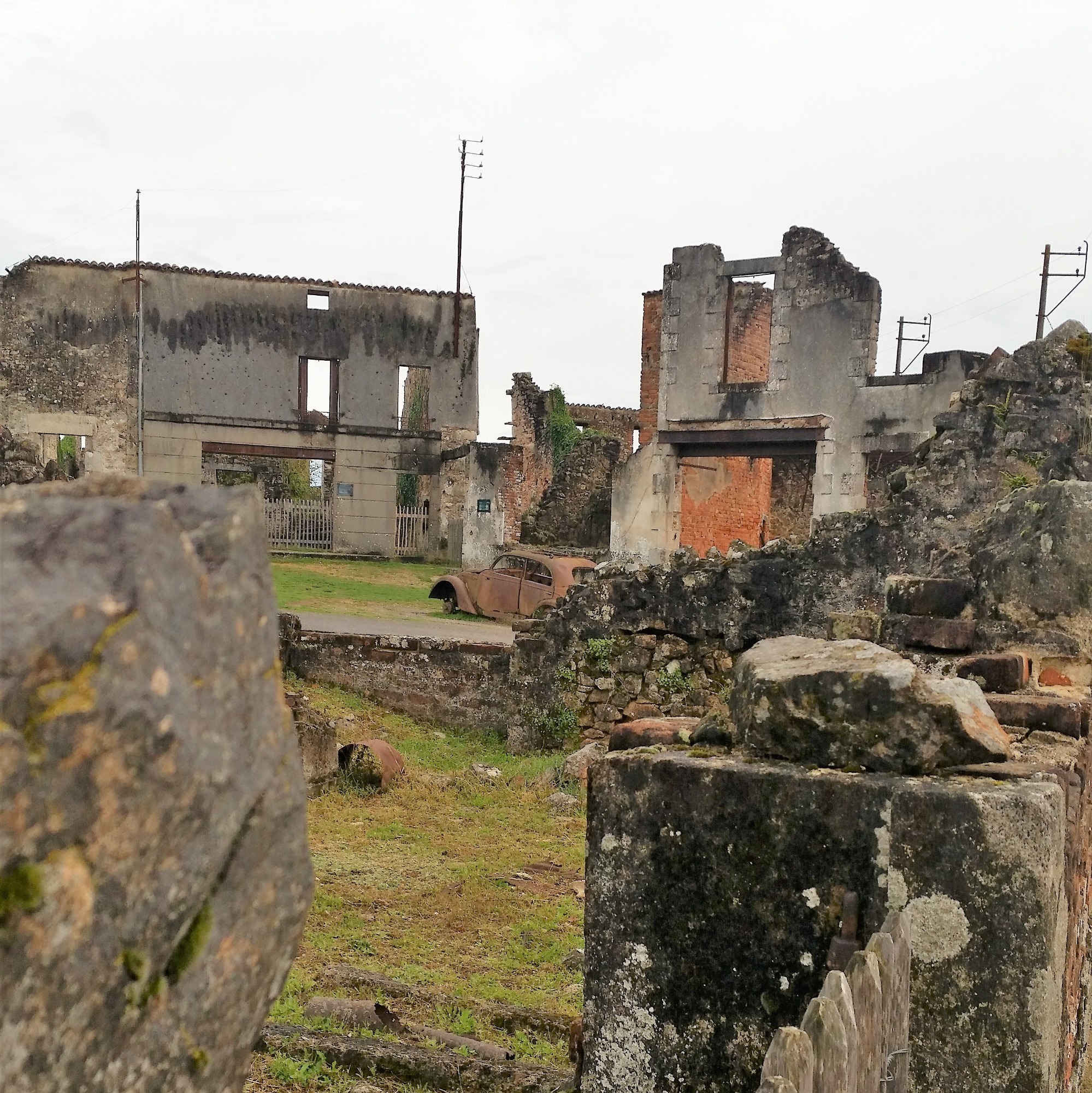 Disused light grey buildings without roofs and 1940