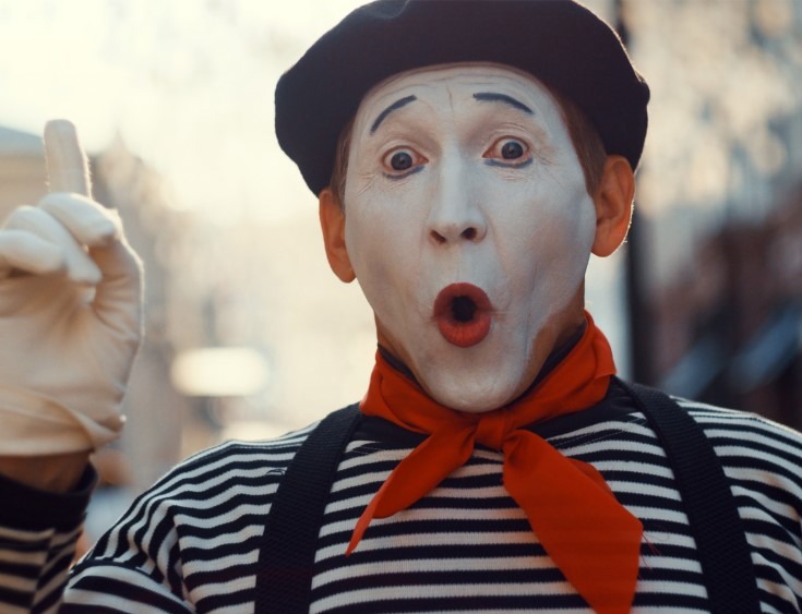 Mime artist in beret and striped top at the MIMOS festival, Périgueux
