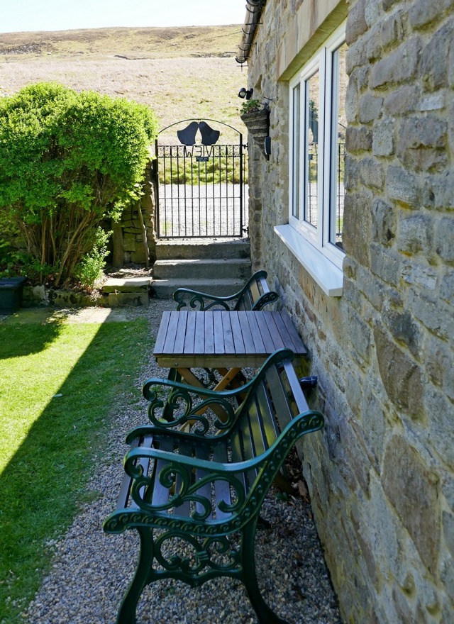 Seating in enclosed cottage garden, ideal for your morning coffee