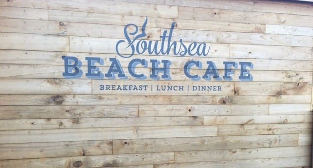 Southsea beach cafe logo on weathered wood panels
