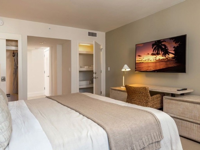 "Beautifully furnished bedroom with smart Samsung tv"