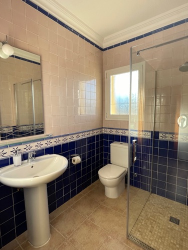 Second shower room with glass walled shower