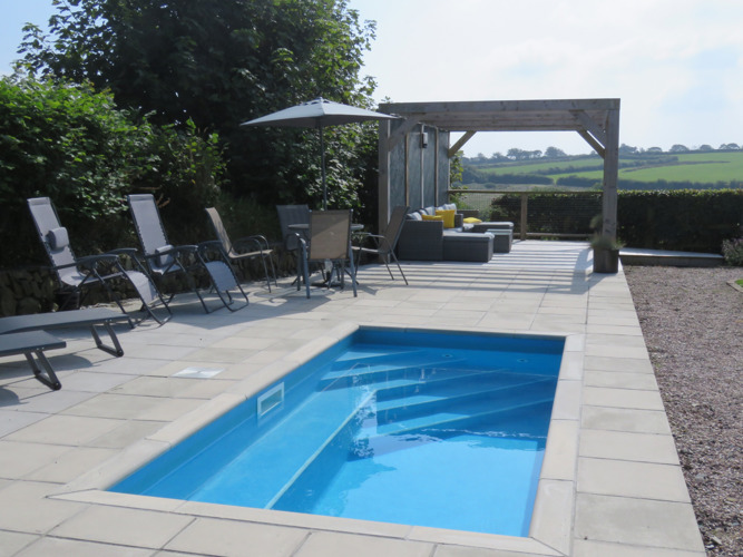 Heated plunge pool and gazebo with rural views