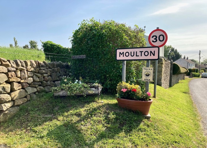 Image of the Moulton village sign taken  by Moulton View Holiday Cottage