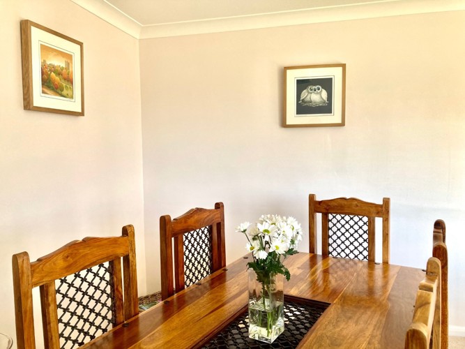Image of table and chairs in dining area of Moulton View Holiday Cottage