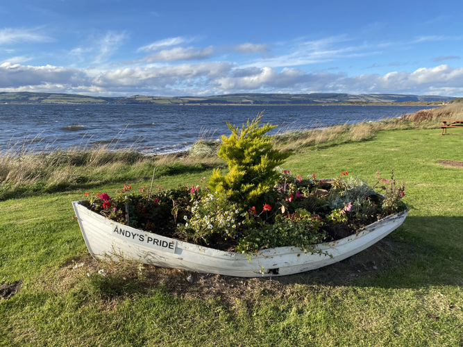 A planter and the Moray Firth at the entrance to Ardersier 