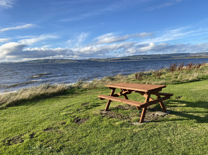 Picnic bench on the Moray Firth in Ardersier