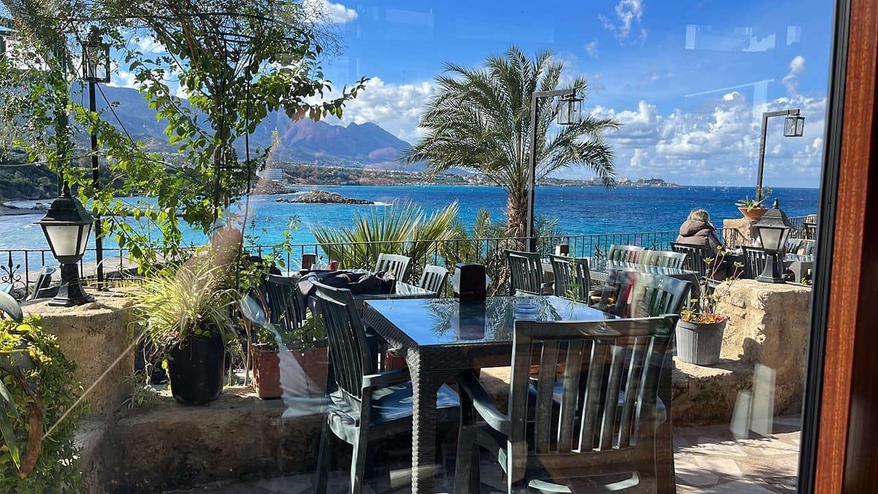 Dining options and nightlife in Northern Cyprus, showcasing a restaurant with a Mediterranean view, offering local cuisine
