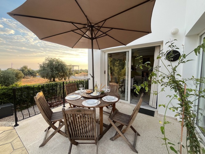 Outdoor dining terrace at Villa Zeytin at sunset