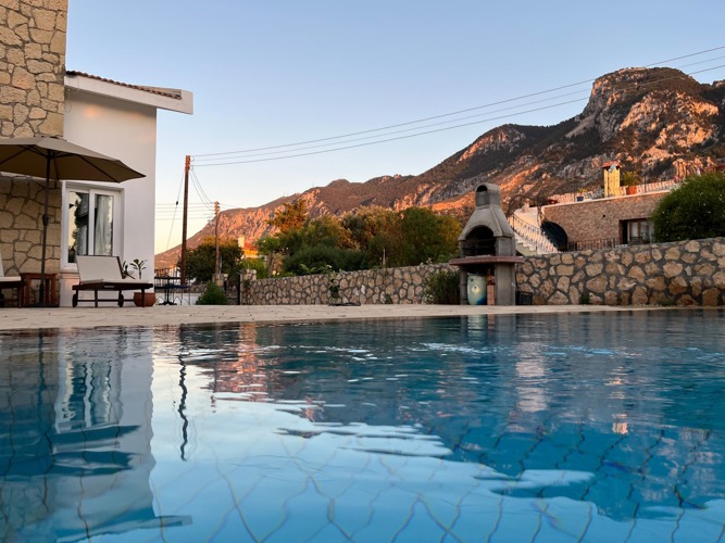 Private pool at Villa Zeytin with the Kyrenia mountain range behind