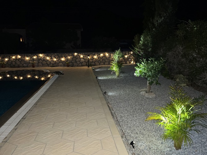 Illuminated garden path at Villa Zeytin in the evening