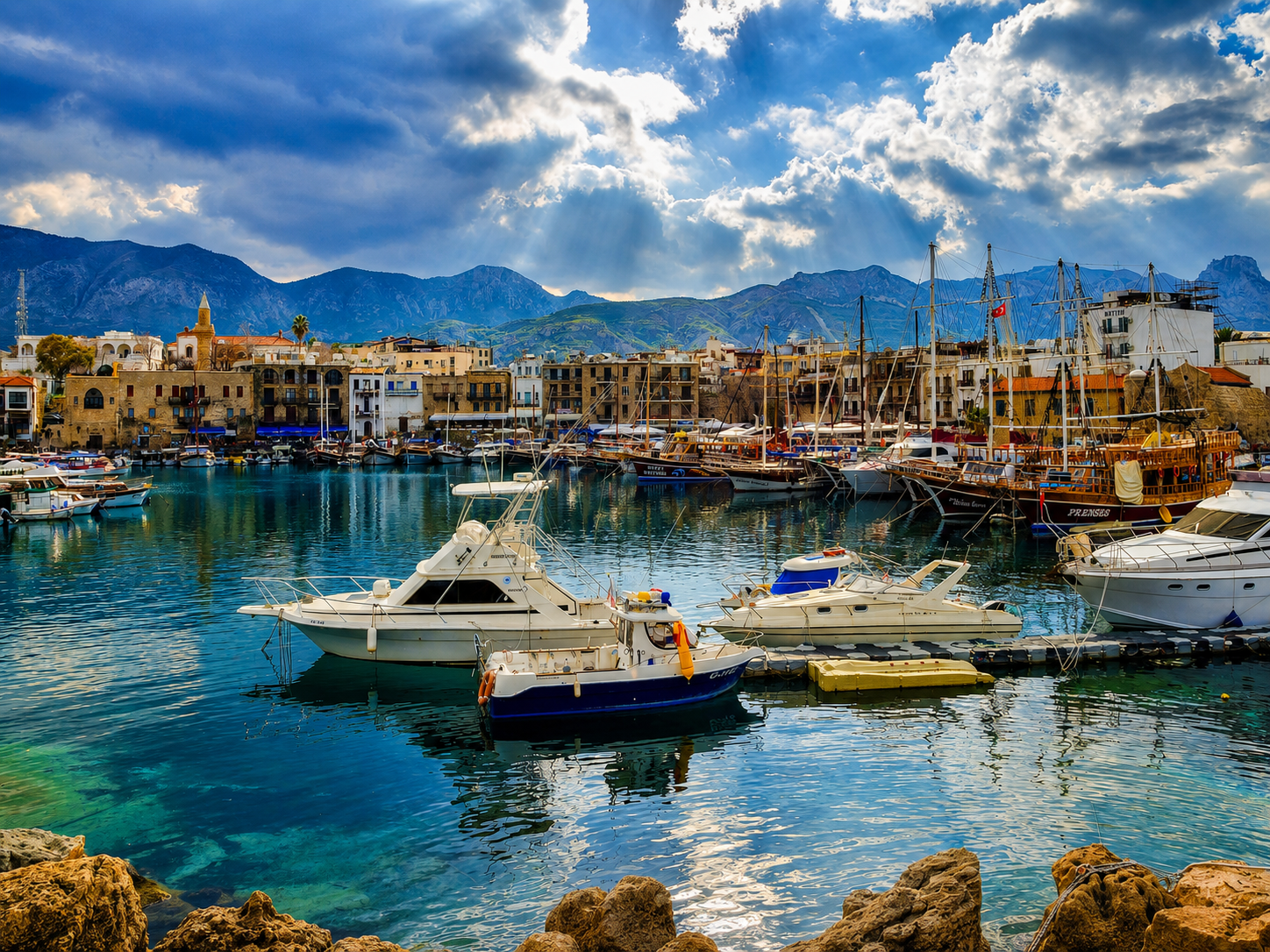 Aerial view of Kyrenia Old Harbour showing the horseshoe-shaped waterfront, boats and castle walls