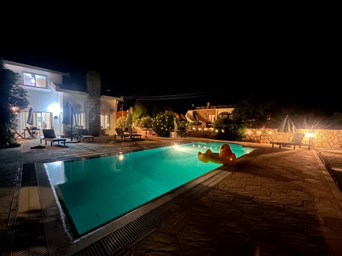 Villa Zeytin illuminated after dark