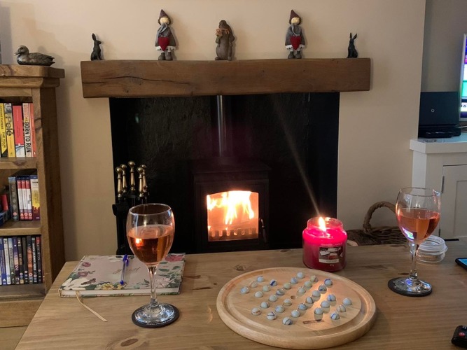 log burner relax unwind cozy comfortable wine