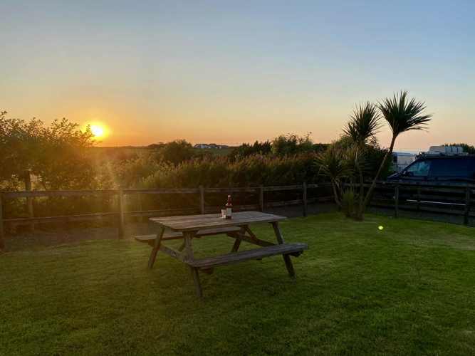 The un-enclosed side garden at sunset