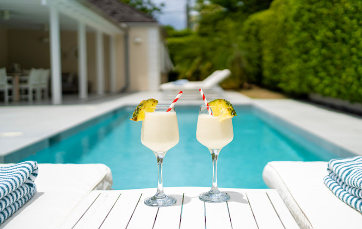 Pina colada cocktails by the pool