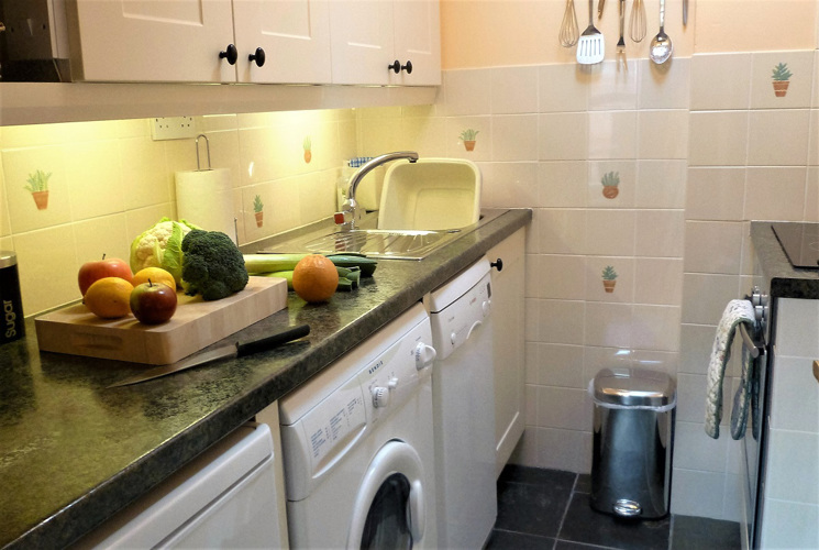Small well equipped kitchen dishwasher washer dryer Coachmans Cottage Steeple Ashton Wiltshire BA14 6HH 1 bedroom self catering cottage for 2 guests